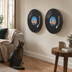 Basic and rotating vinyl-record cat scratchers in a warm living room