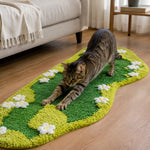 Cat stretching and scratching on the textured green sisal surface