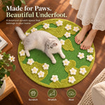 Cat and owner sharing the botanical scratching rug at home