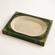 Enchanted book-inspired cat scratcher bed in forest green and cream