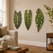 Botanical leaf cat scratchers displayed on a living room wall