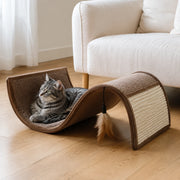 Tabby cat relaxing in the curved cat scratcher lounge