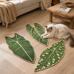 Cat using botanical leaf sisal scratching mats on the floor