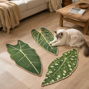 Cat using botanical leaf sisal scratching mats on the floor