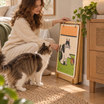 Foldable bamboo cat scratcher stored beside a cabinet
