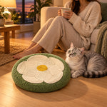 Cat and owner relaxing beside the flower scratcher at evening