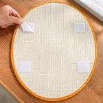 Hook-and-loop mounting tabs on a Halloween cat scratcher